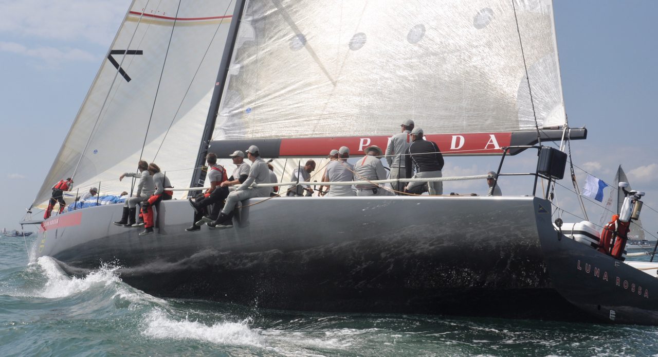 Racing yacht under sail with crew on the rail